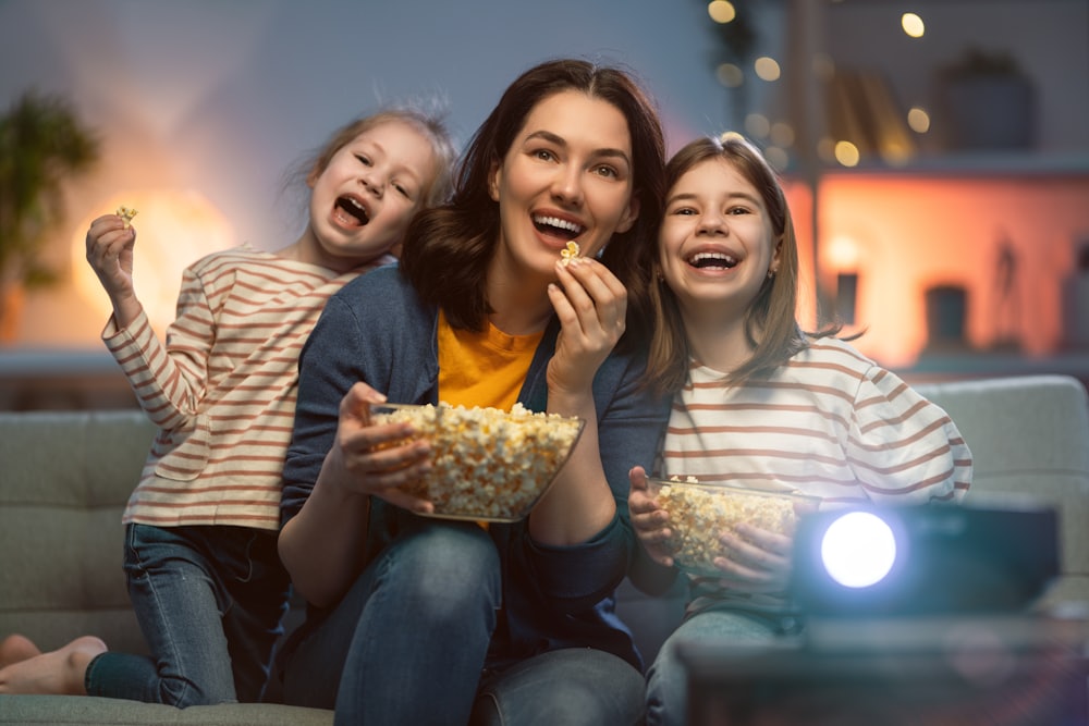 Family enjoying entertainment together on a sofa